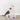 Cat playing with Trixie Junior Scratching Post against a white wall.