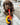 chocolate puppy playing with Nylabone Puppy Chew Teething Keys Dog Toy. Pet City