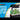 Aqua One Lifestyle Classic Set-Up aquarium with a black lid, black base, clear glass tank, white gravel, green plants, and gray rocks, shown against a blue and white graphic background with the Aqua One logo.