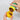 JBL ProNovo Insect Stick Fish Food pouring out of the container